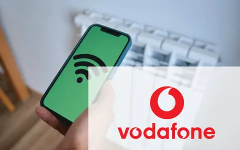 Smartphone con icona Wi-Fi su schermo verde, sovrapposto al logo Vodafone. Un messaggio autoconfigurante Vodafone per la tua connessione.
