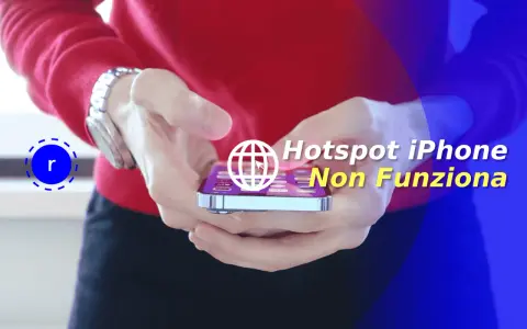 Mani che tengono un iPhone con testo "Hotspot iPhone Non Funziona". Scopri perché l'hotspot si disattiva da solo.