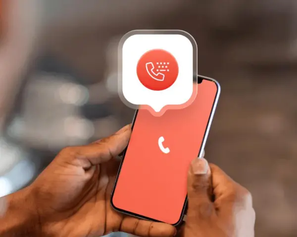 Mani che tengono uno smartphone con un'icona di chiamata e un fumetto che spiega come bloccare i numeri privati.