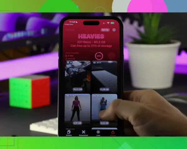 Un iPhone mostra l'app "Heavies" per liberare spazio, con file pesanti come video e foto.