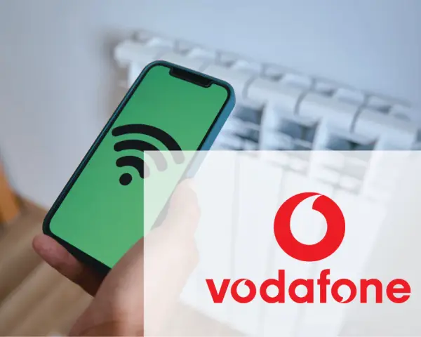 Smartphone con icona Wi-Fi su schermo verde, sovrapposto al logo Vodafone. Un messaggio autoconfigurante Vodafone per la tua connessione.