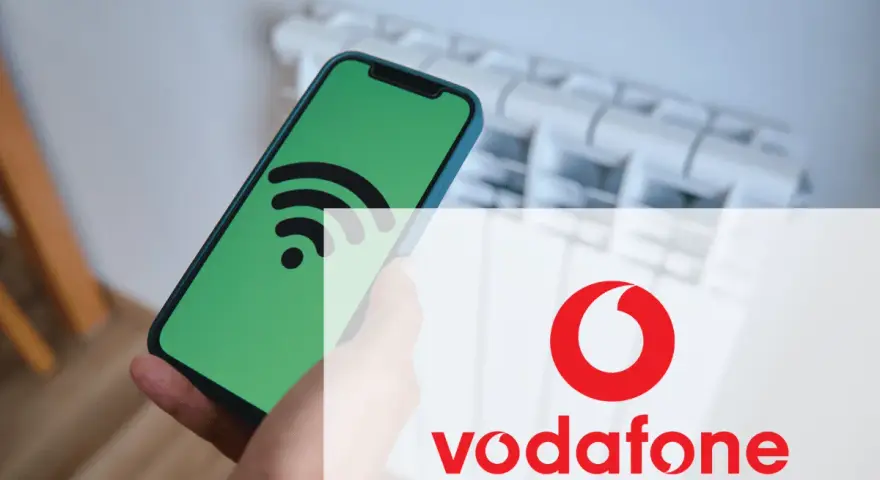 Smartphone con icona Wi-Fi su schermo verde, sovrapposto al logo Vodafone. Un messaggio autoconfigurante Vodafone per la tua connessione.